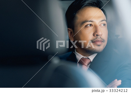 The portrait of a businessman looking something and thinking The portrait of a businessman looking something and thinking 33324212