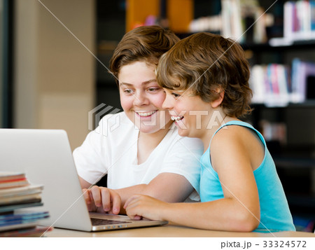 Two boys in library 33324572