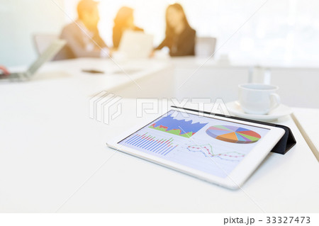 Digital tablet showing chart in meeting room 33327473