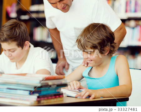 Two boys in library 33327481