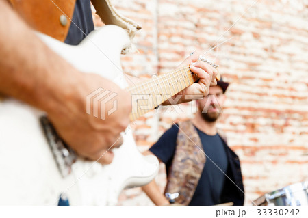 Playing music in the street 33330242