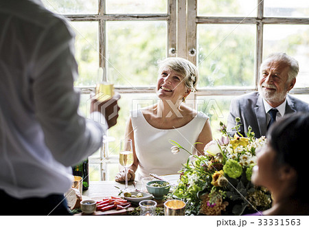 Senior Couple Sitting Cheerful in Wedding Reception 33331563