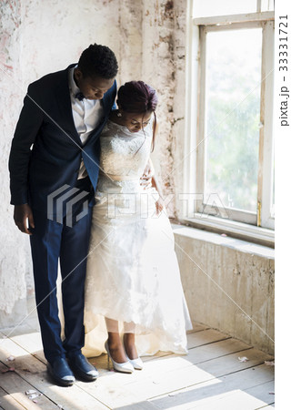 Bride and Groom Standing on Wooden Floor Bride and Groom Standing on Wooden Floor 33331721