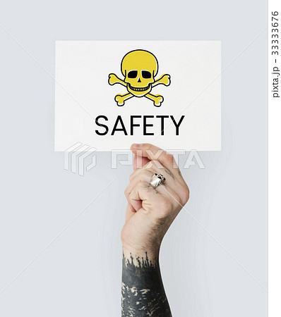 People holding placard with skull icon and chemicals dangerous 33333676