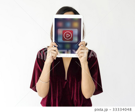Woman holding network graphic overlay digital device covering face 33334048