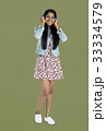 Young indian woman listening music with headphone 33334579