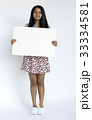 Woman standing doing photoshoot in studio 33334581