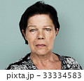 Senior adult woman in moody studio portrait 33334583