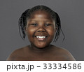Little african girl smiling shirtless studio portrait 33334586