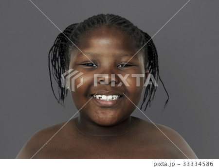 Little african girl smiling shirtless studio portrait Little african girl smiling shirtless studio portrait 33334586