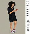 African descent woman using phone 33334592