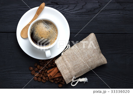 Coffee in a white cup with a saucer Coffee in a white cup with a saucer 33336020
