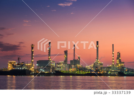 Oil refinery plant and loading dock at twilight. 33337139