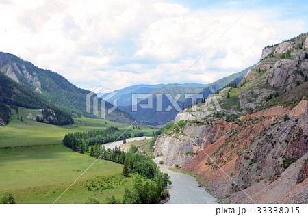 Muddy mountain river from melting snow flowing 33338015