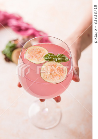 Pink cocktail with fig 33338719