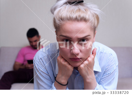 Young couple sitting separately at home 33338720