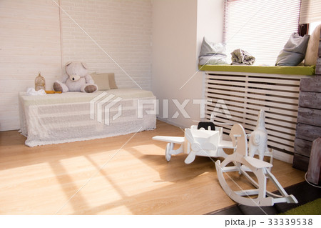 Wooden toy airplane and horses on the floor in  33339538