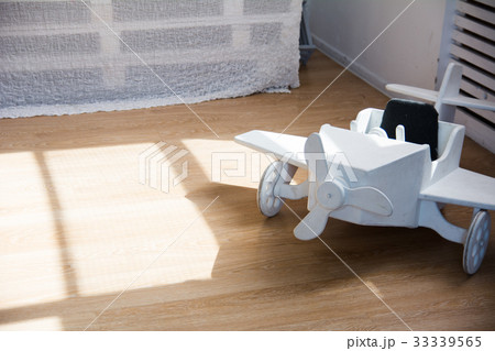 Wooden toy airplane on a wooden floor 33339565