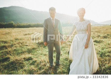 Beautiful wedding couple, love on the sunset Beautiful wedding couple, love on the sunset 33342836