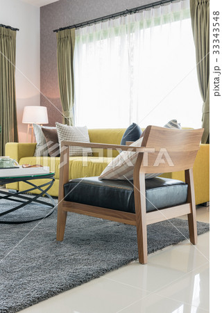 modern wooden chair on carpet 33343548