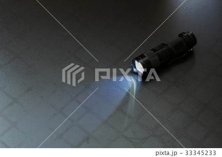 Flashlight and a beam of light Flashlight and a beam of light 33345233