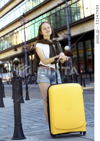 Girl traveler and suitcase 33347494