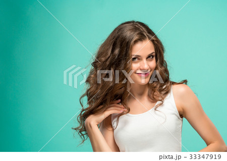 The young woman's portrait with happy emotions The young woman's portrait with happy emotions 33347919
