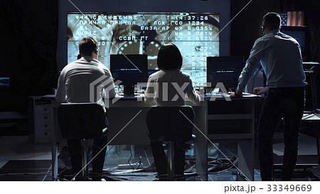 People working in mission control center People working in mission control center 33349669