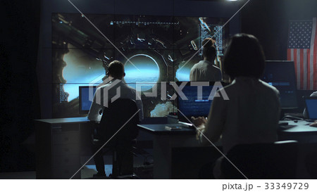 People working in mission control center People working in mission control center 33349729