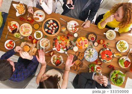 People eat healthy meals at served table dinner People eat healthy meals at served table dinner 33350000