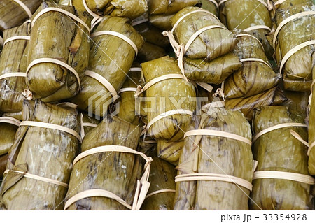 Sticky rice wrapped in banana leaves Sticky rice wrapped in banana leaves 33354928