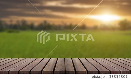 Wood top table on blur blue sky and green 33355301