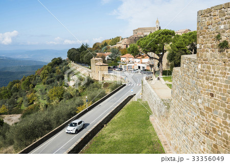Italy, Tuscany, Montalcino, View of ancient Montalcino city and fortress walls on hill Italy, Tuscany, Montalcino, View of ancient Montalcino city and fortress walls on hill 33356049