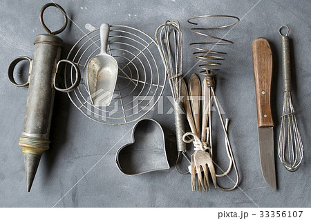 Group of vintage cooking utensils on gray background Group of vintage cooking utensils on gray background 33356107