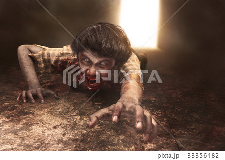 Scary asian zombie man is lying on the floor Scary asian zombie man is lying on the floor 33356482
