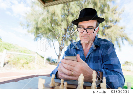 Old man with his mobile 33356555