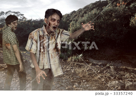 Two asian zombies with wounded face 33357240