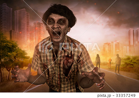 Crowd of aggressive asian zombies walking around 33357249