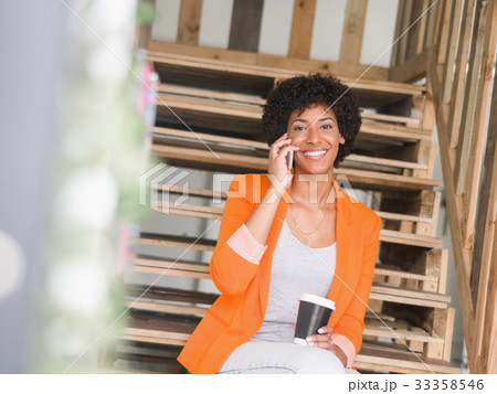 Portrait of young businesswoman with mobile 33358546