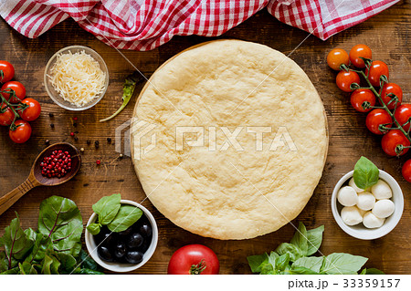 Pizza dough and ingredients for making pizza on 33359157