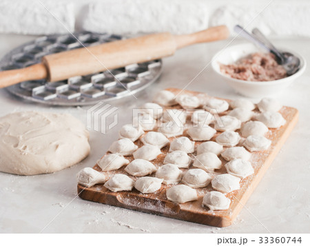 Process of making homemade pelmeni Process of making homemade pelmeni 33360744
