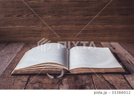 Blank old notebook on wooden table background. Blank old notebook on wooden table background. 33366012