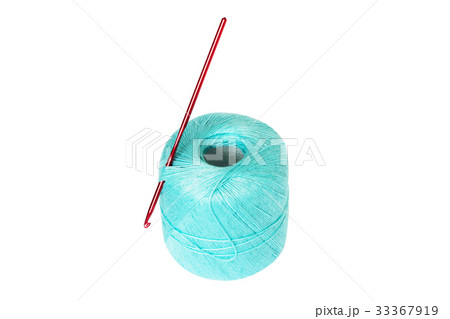 Turquoise thread clew with crochet hook isolated Turquoise thread clew with crochet hook isolated 33367919