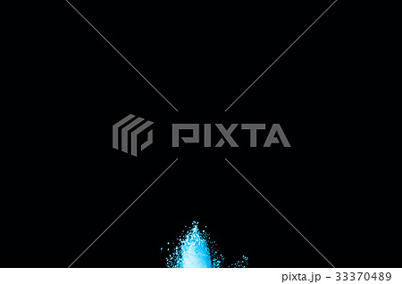 Abstract blue powder splatted on white background. Abstract blue powder splatted on white background. 33370489