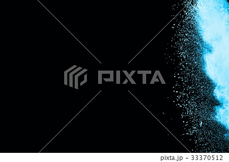 Abstract blue powder splatted on white background. Abstract blue powder splatted on white background. 33370512