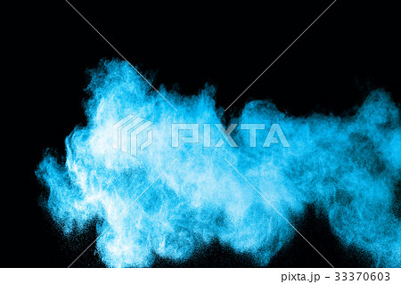 Abstract blue powder splatted on white background. Abstract blue powder splatted on white background. 33370603