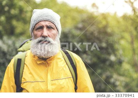 Experienced mature male tourist traveling in wild Experienced mature male tourist traveling in wild 33370941