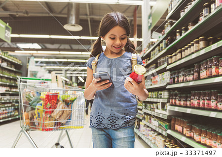 Joyous smiling small lady shopping 33371497