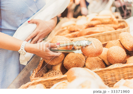 Adult consumer taking small bap Adult consumer taking small bap 33371960