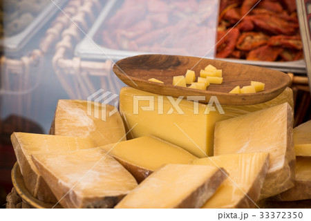 Chunks of different cheeses at a local market 33372350